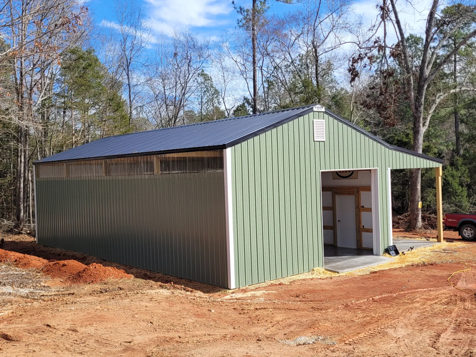 Finished metal building in light green, built to withstand the South Carolina climate