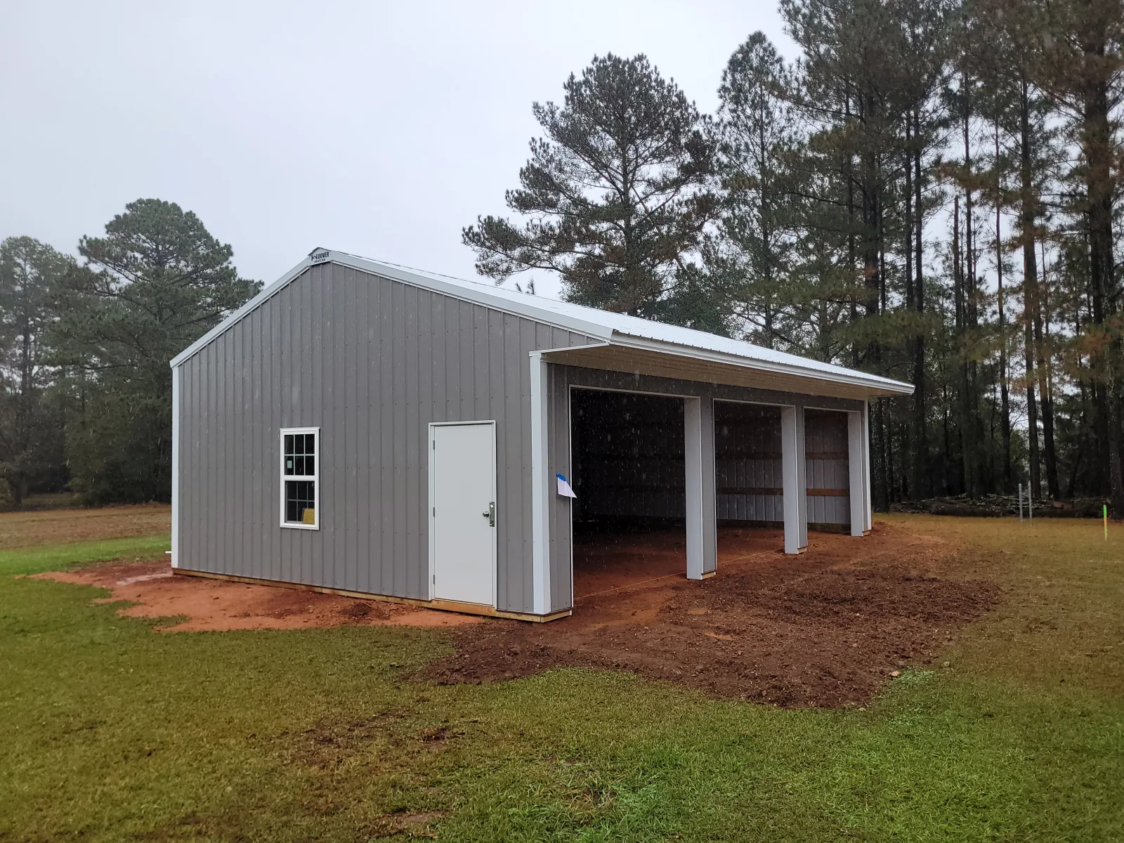Garage building with overhead doors built by Hoover Building Systems